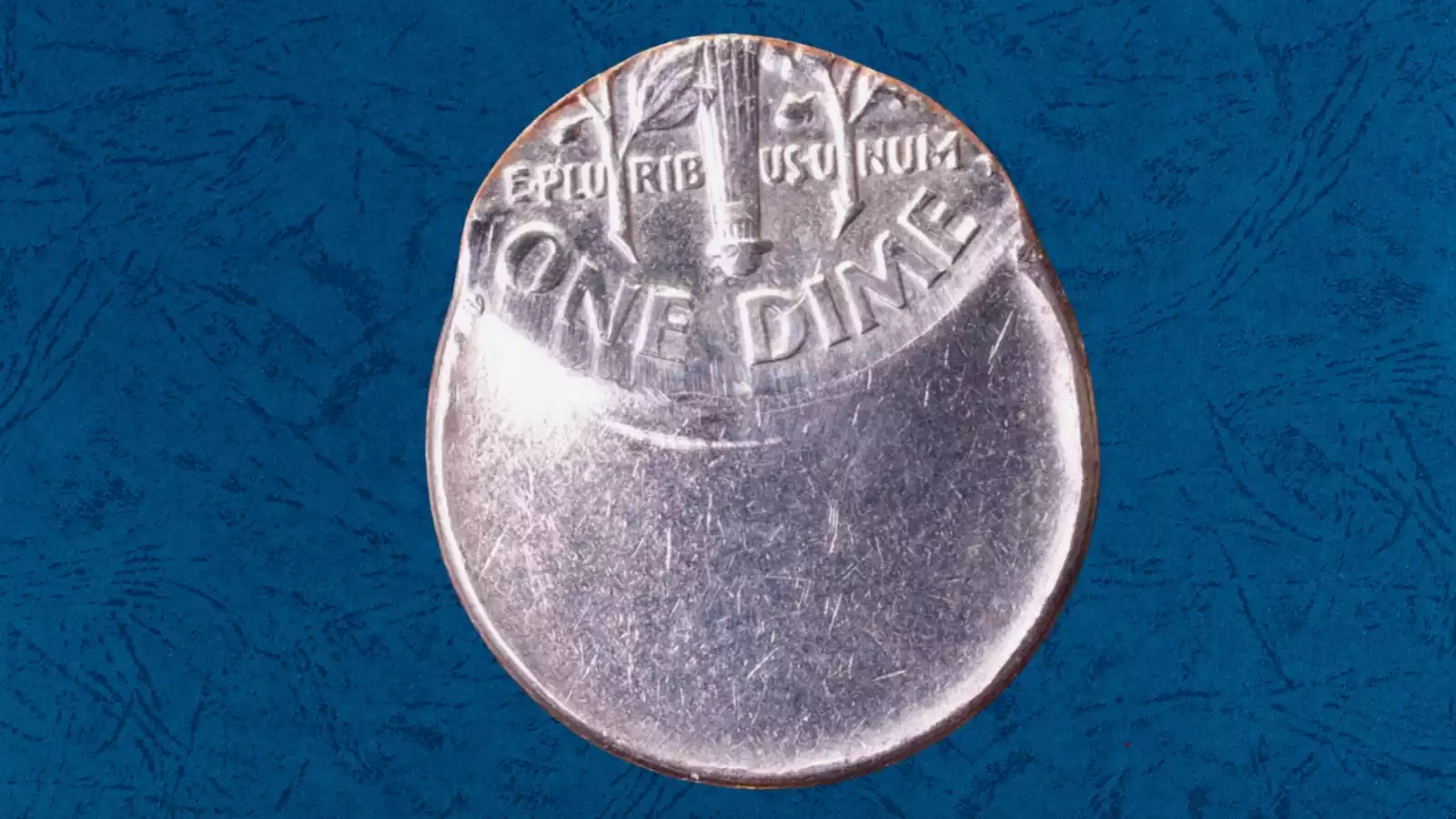 2016 Roosevelt dime off-center strike error showing design shifted with blank crescent area